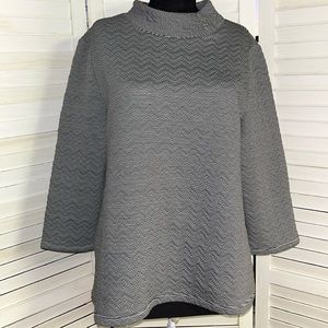 this is a chico’s weekend black and white top size 1